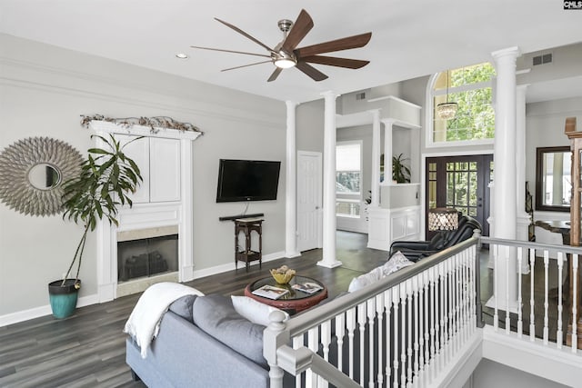 1305 Rock Island Rd, Gilbert, SC 29054 - living area with ceiling fan, visible vents, ornate columns, and a healthy amount of sunlight