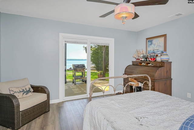 1305 Rock Island Rd, Gilbert, SC 29054 - bedroom with baseboards, visible vents, wood finished floors, access to outside, and ceiling fan