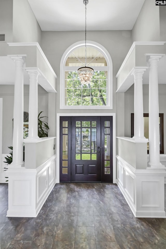 1305 Rock Island Rd, Gilbert, SC 29054 - entrance foyer featuring an inviting chandelier, a towering ceiling, visible vents, and ornate columns