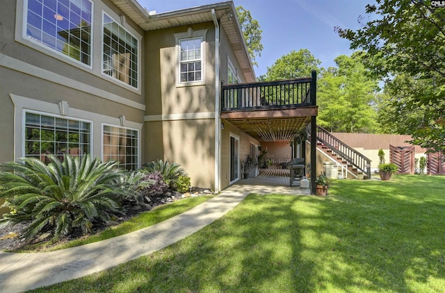1305 Rock Island Rd, Gilbert, SC 29054 - back of property featuring a wooden deck, stairs, a yard, a patio, and stucco siding