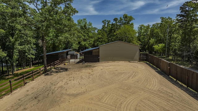 1305 Rock Island Rd, Gilbert, SC 29054 - view of home's exterior with an outdoor structure, a pole building, an exterior structure, and an enclosed area