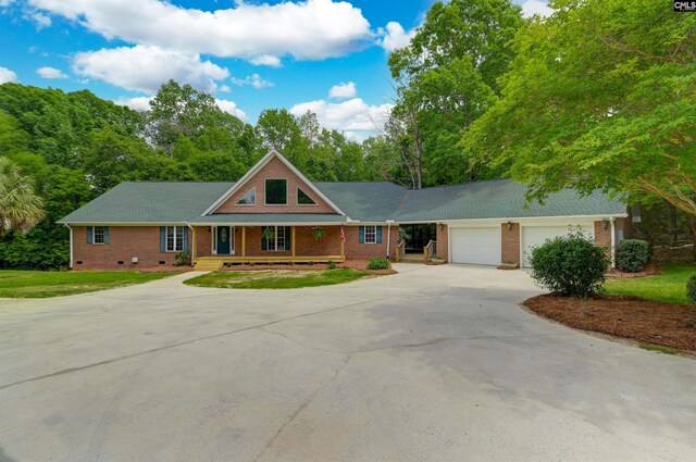 2310 Priceville Rd, Gilbert, SC 29054 - view of front of property with concrete driveway, an attached garage, brick siding, and covered porch