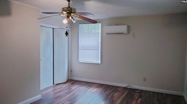 924 Stebondale Rd, Columbia, SC 29203 - unfurnished bedroom featuring a wall mounted AC, wood finished floors, baseboards, and a closet