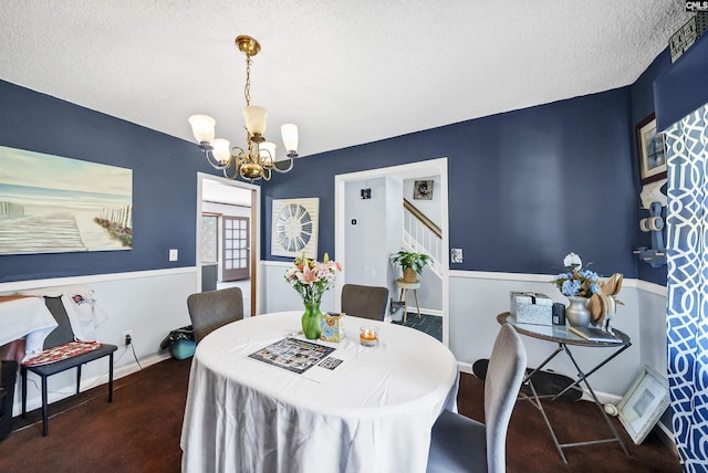 320 Brookshire Dr, Columbia, SC 29210 - dining room featuring baseboards, a chandelier, a textured ceiling, carpet flooring, and stairs