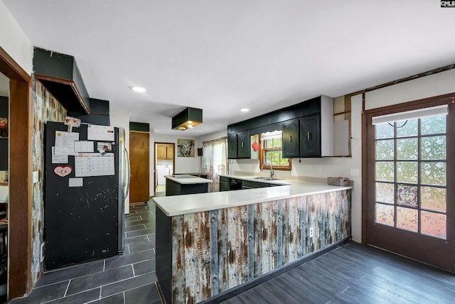 320 Brookshire Dr, Columbia, SC 29210 - kitchen with light countertops, a healthy amount of sunlight, a sink, and a peninsula
