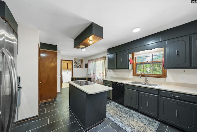 320 Brookshire Dr, Columbia, SC 29210 - kitchen featuring a center island, a sink, black appliances, light countertops, and washing machine and dryer