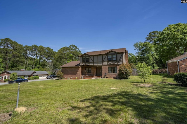320 Brookshire Dr, Columbia, SC 29210 - rear view of property with a lawn, brick siding, and a balcony