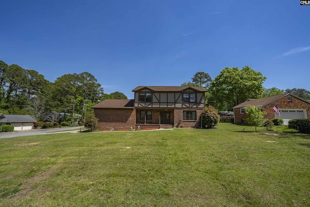 320 Brookshire Dr, Columbia, SC 29210 - view of front of home featuring brick siding, a detached garage, and a front lawn