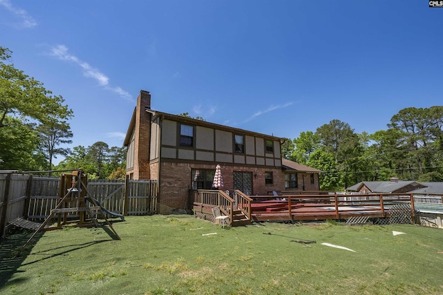 320 Brookshire Dr, Columbia, SC 29210 - rear view of property with a chimney, a fenced backyard, a wooden deck, a lawn, and brick siding