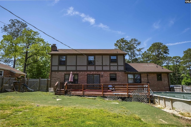 320 Brookshire Dr, Columbia, SC 29210 - rear view of house with a chimney, a fenced in pool, a fenced backyard, a wooden deck, and brick siding