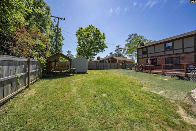 320 Brookshire Dr, Columbia, SC 29210 - view of yard featuring a fenced backyard, an outbuilding, a deck, and a shed