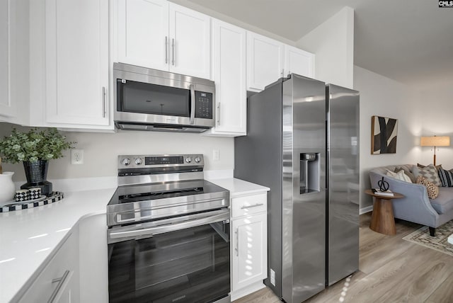 227 Carillo Dr, Columbia, SC 29223 - kitchen featuring white cabinets, light countertops, light wood-type flooring, and appliances with stainless steel finishes