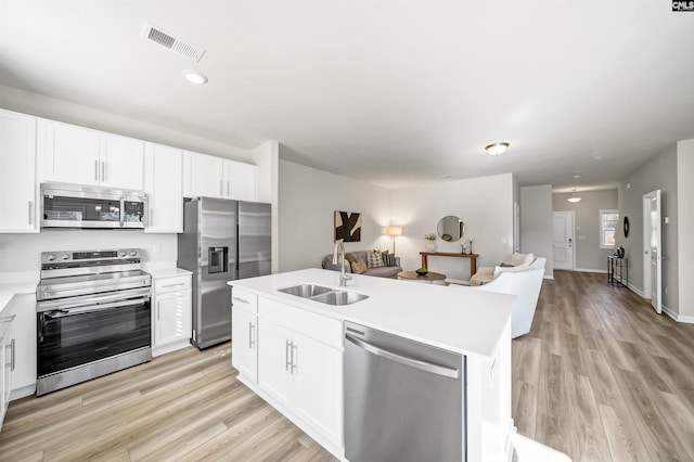 227 Carillo Dr, Columbia, SC 29223 - kitchen featuring visible vents, a sink, light wood-style floors, appliances with stainless steel finishes, and open floor plan