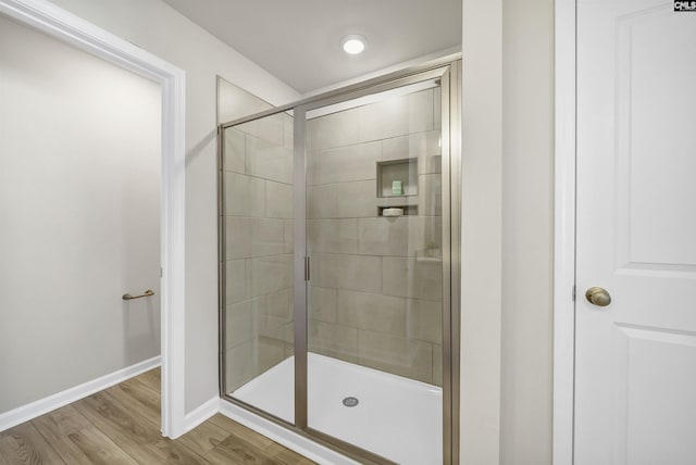 227 Carillo Dr, Columbia, SC 29223 - bathroom featuring baseboards, wood finished floors, and a stall shower