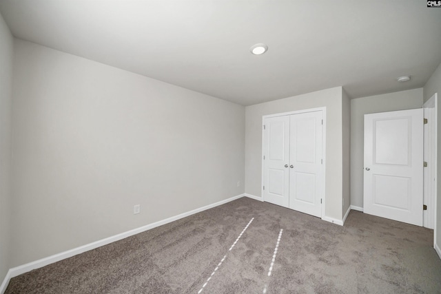 227 Carillo Dr, Columbia, SC 29223 - unfurnished bedroom with baseboards, carpet floors, and a closet