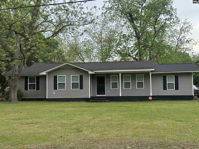 ranch-style home featuring crawl space, covered porch, a shingled roof, and a front yard
