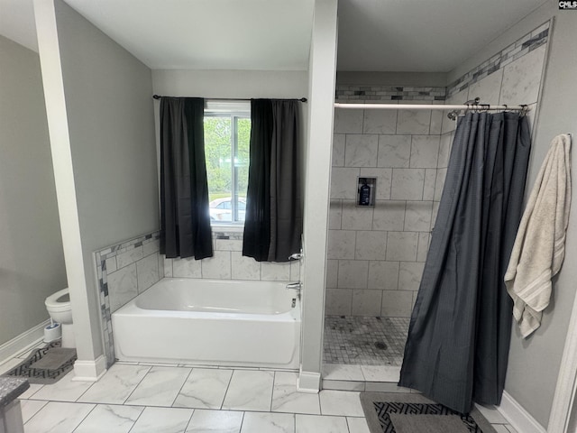 bathroom with baseboards, a garden tub, marble finish floor, and tiled shower
