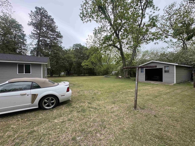 view of yard featuring an outbuilding and a garage