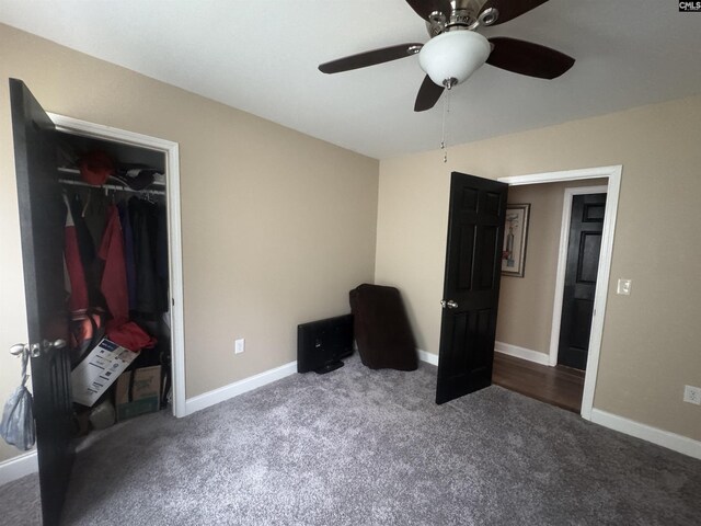 unfurnished bedroom with a ceiling fan, baseboards, carpet floors, and a closet