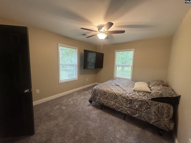 bedroom featuring carpet floors, a ceiling fan, and baseboards