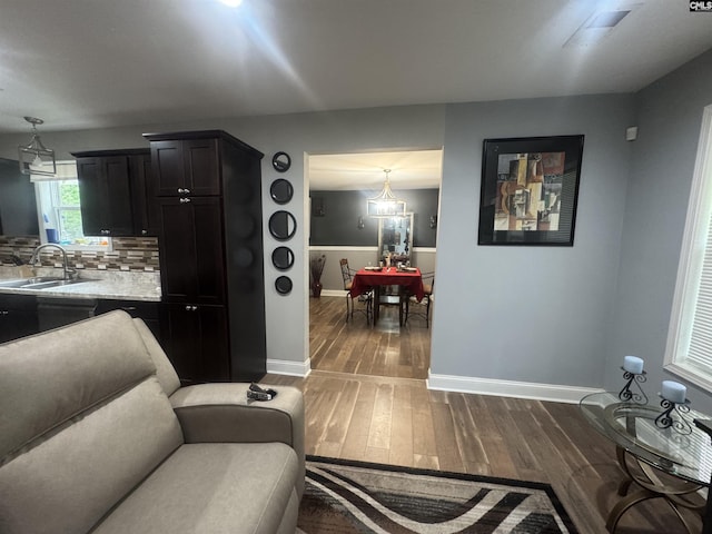 living room featuring baseboards and dark wood-style floors