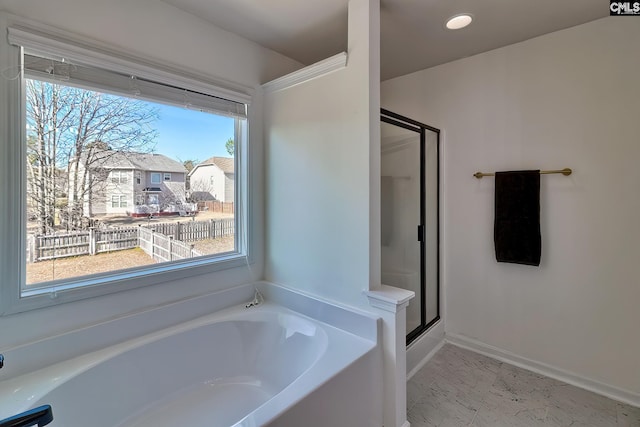 207 Ashewicke Dr, Columbia, SC 29229 - bathroom featuring a bath, baseboards, marble finish floor, and a shower stall