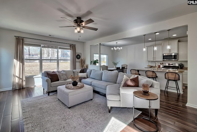207 Ashewicke Dr, Columbia, SC 29229 - living room featuring recessed lighting, wood finish floors, baseboards, and ceiling fan with notable chandelier