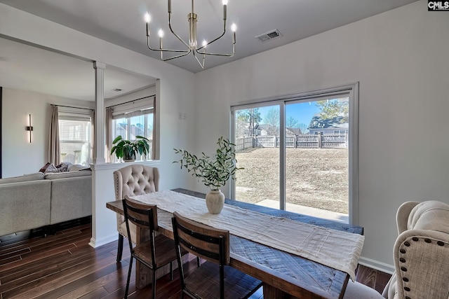 207 Ashewicke Dr, Columbia, SC 29229 - dining room featuring dark wood finished floors, visible vents, baseboards, and a notable chandelier