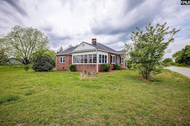 1742 Orrs Station Rd, Chester, SC 29706 - exterior space with brick siding, a front yard, and a chimney