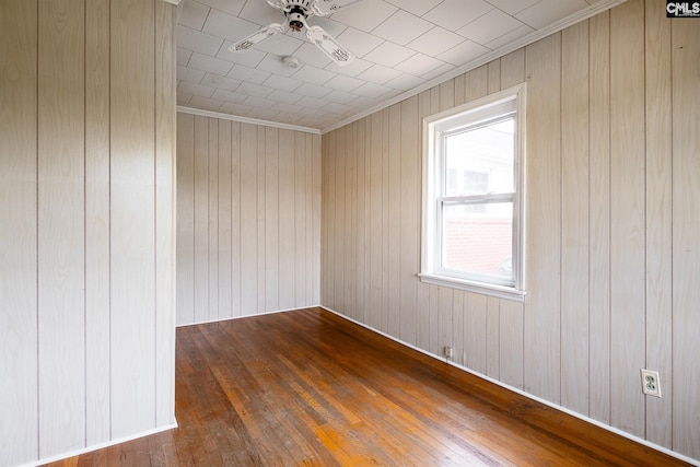 1742 Orrs Station Rd, Chester, SC 29706 - empty room with wooden walls, hardwood / wood-style floors, crown molding, and ceiling fan