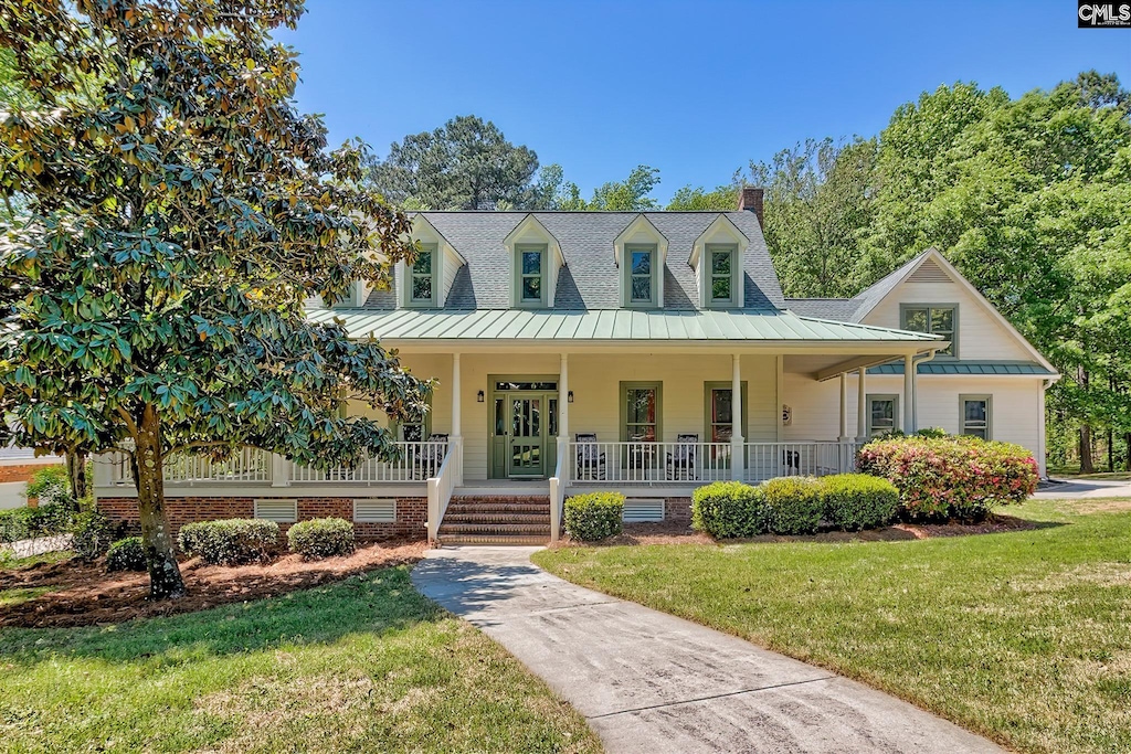 4 Tavern Ct, Blythewood, SC 29016 - cape cod-style house with a front lawn, covered porch, a chimney, and a standing seam roof