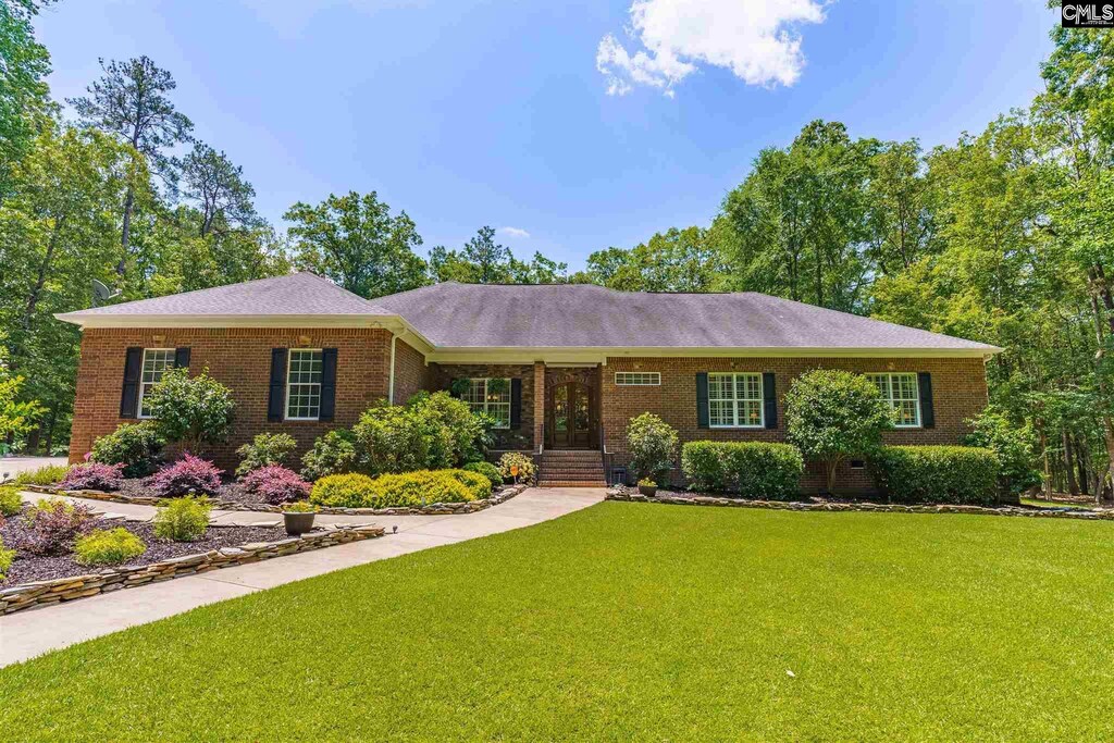 1215 Jake Eargle Rd, Little Mountain, SC 29075 - ranch-style home featuring a front lawn and brick siding