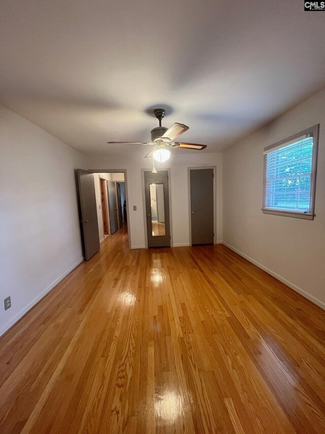 326 Nell St, Batesburg, SC 29006 - empty room featuring light wood-type flooring, baseboards, and ceiling fan