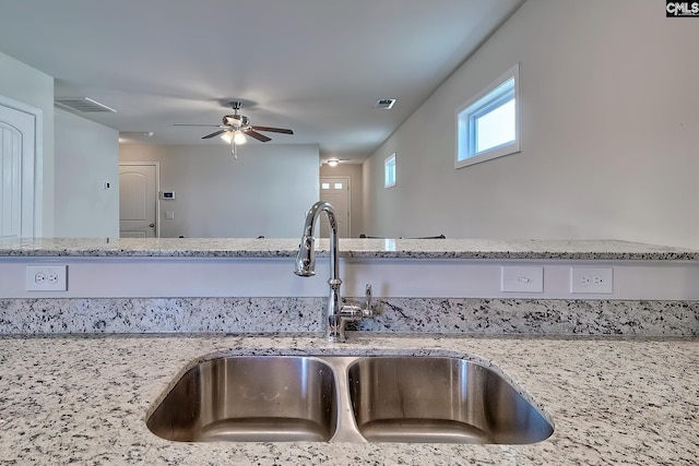 258 Gum Swamp Trl, West Columbia, SC 29169 - kitchen featuring light stone countertops, visible vents, ceiling fan, and a sink