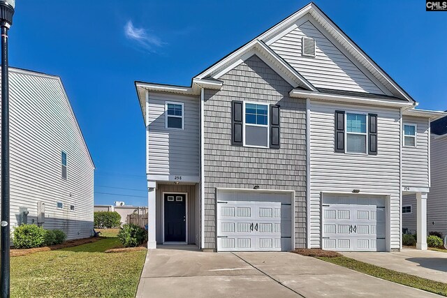 258 Gum Swamp Trl, West Columbia, SC 29169 - view of front of property with an attached garage, driveway, and a front yard