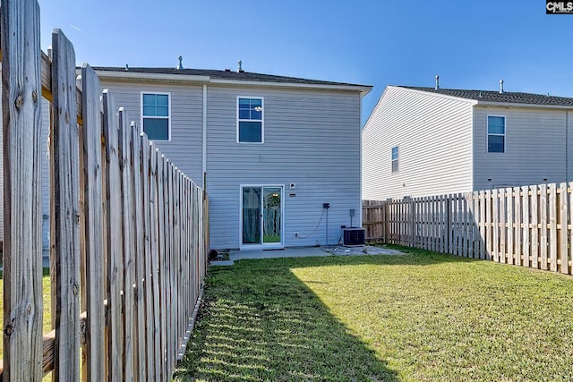 258 Gum Swamp Trl, West Columbia, SC 29169 - back of property featuring central air condition unit, a lawn, and a fenced backyard