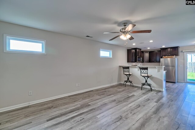 258 Gum Swamp Trl, West Columbia, SC 29169 - kitchen featuring a kitchen breakfast bar, dark brown cabinets, stainless steel appliances, visible vents, and recessed lighting