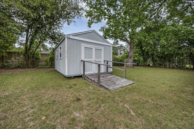 view of shed with fence