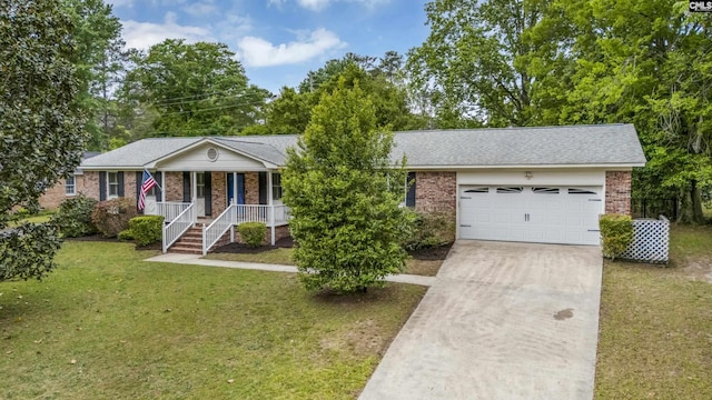 ranch-style home featuring concrete driveway, an attached garage, covered porch, brick siding, and a front yard