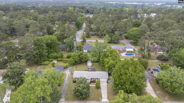 birds eye view of property with a forest view
