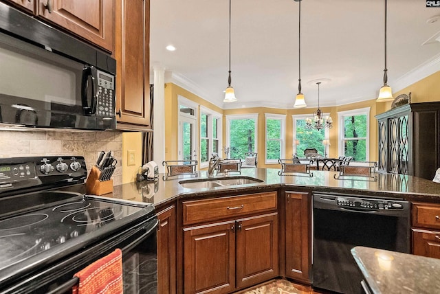 1437 Heins Rd, Blythewood, SC 29016 - kitchen featuring dark stone counters, ornamental molding, a sink, and black appliances