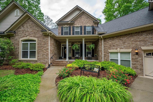 1437 Heins Rd, Blythewood, SC 29016 - view of front facade featuring covered porch, brick siding, and a shingled roof