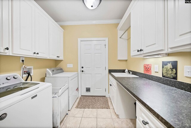 1437 Heins Rd, Blythewood, SC 29016 - clothes washing area featuring a sink, washer and clothes dryer, ornamental molding, cabinet space, and light tile patterned floors