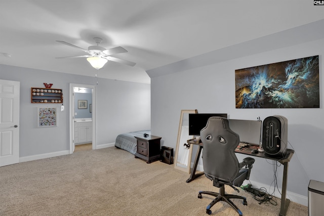 office space featuring carpet, ceiling fan, and baseboards