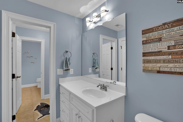 bathroom featuring tile patterned floors, visible vents, toilet, and vanity