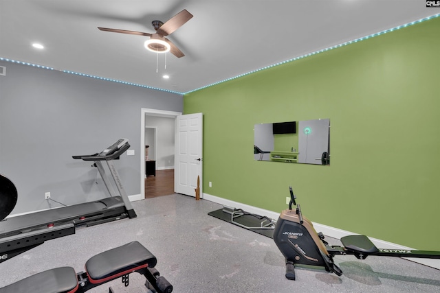 exercise room featuring recessed lighting, a ceiling fan, and baseboards