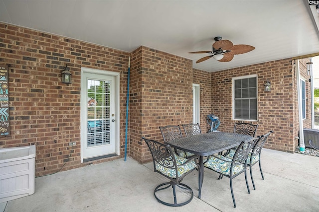 view of patio with a ceiling fan and outdoor dining area