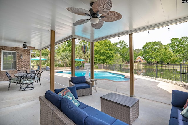 view of patio / terrace featuring a fenced in pool, an outdoor hangout area, ceiling fan, and a fenced backyard