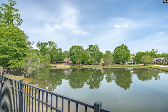 view of water feature with fence