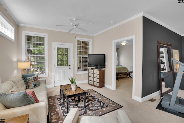 living room with light colored carpet, ceiling fan, ornamental molding, and baseboards